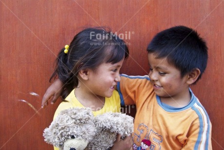 Fair Trade Photo 5-10 years, Colour image, Day, Friendship, Horizontal, Hug, Love, Multi-coloured, Outdoor, People, Peru, Portrait halfbody, Smile, Smiling, South America, Teddybear, Together, Two children