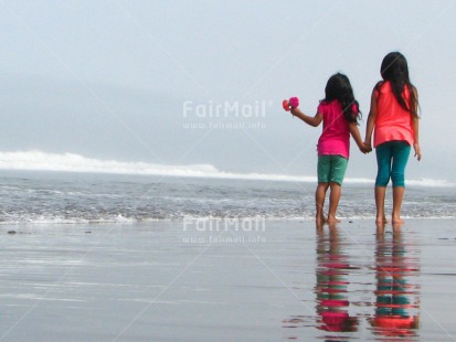 Fair Trade Photo 10-15 years, 5 -10 years, Activity, Beach, Children, Colour image, Flowers, Friendship, Girls, Holding, Holding hands, Horizontal, Latin, People, Peru, Sea, Sister, Sorry, South America, Thank you, Walking, Water