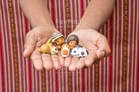 Fair Trade Photo Activity, Adjective, Body, Celebrating, Christianity, Christmas, Christmas decoration, Creche, Ethnic, Family, Hand, Horizontal, Object, People, Peruvian fabric, Present