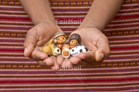 Fair Trade Photo Activity, Adjective, Body, Celebrating, Christianity, Christmas, Christmas decoration, Creche, Ethnic, Family, Hand, Horizontal, Object, People, Peruvian fabric, Present