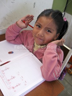 Fair Trade Photo Activity, Colour image, Day, Education, Exams, Girl, Good luck, Indoor, Looking at camera, One girl, People, Peru, Portrait headshot, School, Smiling, Social issues, South America, Vertical, Well done