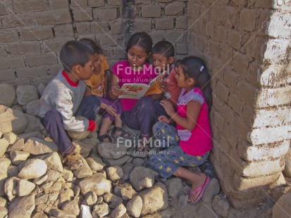 Fair Trade Photo Activity, Casual clothing, Clothing, Colour image, Cooperation, Dailylife, Day, Education, Friendship, Group of children, Horizontal, Outdoor, People, Peru, Portrait fullbody, Reading, Sitting, South America, Streetlife, Studying