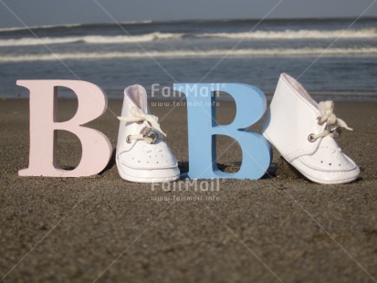 Fair Trade Photo Beach, Birth, Closeup, Colour image, Day, Horizontal, New baby, Outdoor, Peru, Sand, Sea, Shoe, South America, Summer