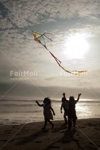 Fair Trade Photo 5 -10 years, Activity, Beach, Colour image, Emotions, Evening, Freedom, Group of girls, Happiness, Kite, Outdoor, People, Peru, Playing, Sea, Sky, South America, Summer, Sun