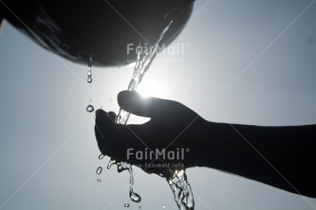 Fair Trade Photo Backlit, Black and white, Closeup, Colour image, Hand, Hygiene, One child, Peru, Sanitation, Silhouette, South America, Water, Waterdrop