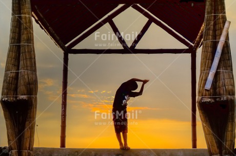 Fair Trade Photo Colour image, Evening, Horizontal, One boy, One child, Outdoor, Peace, People, Peru, Shooting style, Silhouette, South America, Spirituality, Sunset, Wellness, Yoga