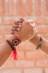 Fair Trade Photo Activity, Bracelet, Brick, Colour image, Dreamcatcher, Feather, Friendship, Good luck, Hands, Holding, Holding hands, Peace, Peru, Red, South America, Strength, Success, Team, Together, Vertical