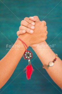 Fair Trade Photo Activity, Blue, Bracelet, Colour image, Dreamcatcher, Feather, Friendship, Good luck, Hands, Holding, Holding hands, Peace, Peru, Red, South America, Strength, Success, Team, Together, Vertical