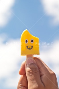 Fair Trade Photo Birthday, Chachapoyas, Clouds, Colour image, Food and alimentation, Hand, Holiday, Ice cream, Icicle, Peru, Sky, South America, Vertical, Yellow