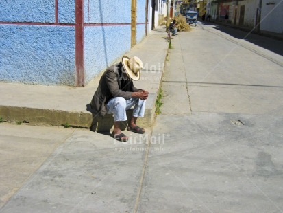 Fair Trade Photo Activity, Colour image, Dailylife, Emotions, Ethnic-folklore, Hat, Horizontal, Latin, Multi-coloured, Old age, One man, Outdoor, People, Peru, Portrait fullbody, Rural, Sadness, Sandals, Sitting, Sombrero, Sorry, South America, Streetlife, Thinking, Thinking of you, Wisdom