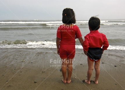 Fair Trade Photo 5-10 years, Activity, Beach, Care, Colour image, Day, Family, Friendship, Holding hands, Horizontal, Love, Outdoor, People, Peru, Red, Responsibility, Sand, Sea, South America, Thinking of you, Together, Two children, Values, Water