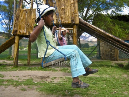 Fair Trade Photo 5 -10 years, Activity, Casual clothing, Clothing, Colour image, Day, Friendship, Game, Hat, Horizontal, Latin, Outdoor, People, Peru, Playing, South America, Two children, Two girls