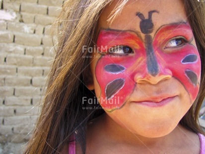 Fair Trade Photo 5-10 years, Activity, Butterfly, Colour image, Day, Decoration, Ethnic-folklore, Horizontal, Looking away, One child, One girl, Outdoor, People, Peru, Portrait headshot, Smiling, South America