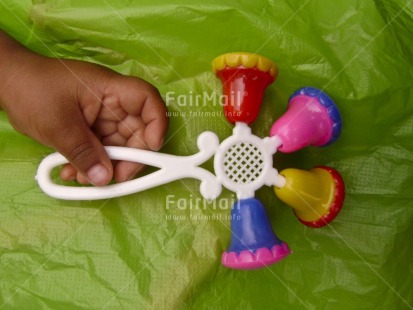 Fair Trade Photo Birth, Closeup, Colour image, Green, Hand, Horizontal, Multi-coloured, New baby, Peru, Pregnant, South America, Toy