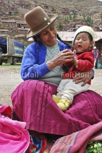 Fair Trade Photo Activity, Care, Clothing, Colour image, Dailylife, Ethnic-folklore, Family, Hat, Looking away, Love, Market, Multi-coloured, One boy, One woman, Outdoor, People, Peru, Portrait fullbody, Smile, Smiling, South America, Streetlife, Vertical