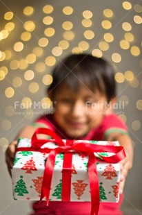 Fair Trade Photo Activity, Adjective, Body, Boy, Celebrating, Child, Christmas, Christmas decoration, Gift, Hand, Light, Nature, Object, People, Present, Vertical