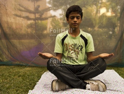 Fair Trade Photo 10-15 years, Activity, Casual clothing, Clothing, Colour image, Day, Forest, Garden, Horizontal, Meditating, One boy, Outdoor, Peace, People, Peru, Sitting, South America, Wellness, Yoga