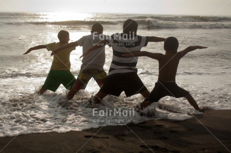 Fair Trade Photo 10-15 years, Activity, Beach, Casual clothing, Clothing, Colour image, Cooperation, Friendship, Group of boys, Health, Horizontal, Latin, Outdoor, People, Peru, Sea, South America, Sport, Together, Water, Yoga