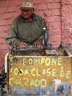 Fair Trade Photo 60-65 years, Activity, Colour image, Day, Entrepreneurship, Latin, Looking away, Old age, One man, Outdoor, People, Peru, Portrait halfbody, Shoe, Smiling, South America, Street, Streetlife, Vertical, Working
