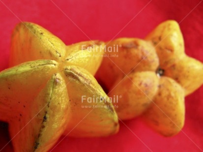 Fair Trade Photo Christmas, Closeup, Colour image, Food and alimentation, Fruits, Health, Horizontal, Peru, Red, South America, Star, Starfruit, Yellow