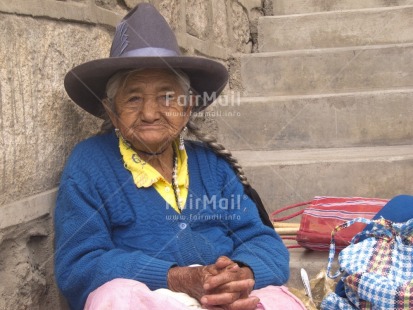 Fair Trade Photo Activity, Blue, Casual clothing, Clothing, Colour image, Dailylife, Ethnic-folklore, Hat, Horizontal, Looking away, Multi-coloured, Old age, One woman, Outdoor, People, Peru, Portrait halfbody, Sombrero, South America, Street, Streetlife