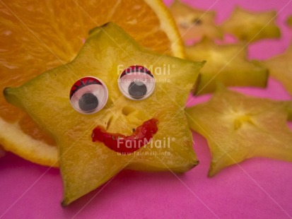 Fair Trade Photo Closeup, Colour image, Food and alimentation, Fruits, Get well soon, Health, Horizontal, Indoor, Orange, Peru, Smile, Smiling, South America, Star, Starfruit, Studio, Tabletop