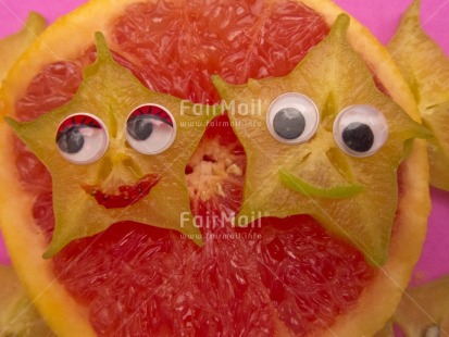 Fair Trade Photo Closeup, Colour image, Food and alimentation, Fruits, Get well soon, Health, Horizontal, Indoor, Orange, Peru, Smile, Smiling, South America, Star, Starfruit, Studio, Tabletop