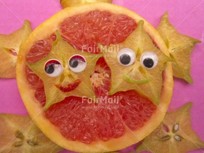 Fair Trade Photo Closeup, Colour image, Food and alimentation, Fruits, Get well soon, Health, Horizontal, Indoor, Orange, Peru, Smile, Smiling, South America, Star, Starfruit, Studio, Tabletop