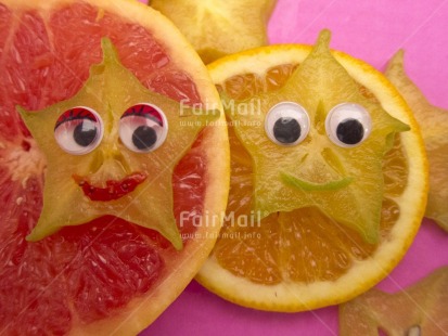 Fair Trade Photo Closeup, Colour image, Food and alimentation, Fruits, Get well soon, Health, Horizontal, Indoor, Orange, Peru, Smile, Smiling, South America, Star, Starfruit, Studio, Tabletop