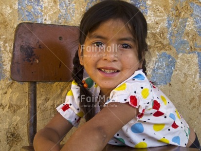 Fair Trade Photo 5-10 years, Activity, Casual clothing, Clothing, Colour image, Day, Education, Horizontal, Indoor, Latin, Looking at camera, One girl, People, Peru, Portrait halfbody, School, Smiling, South America
