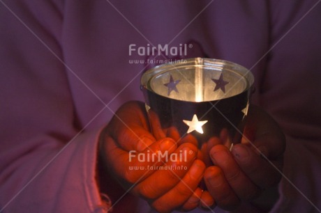 Fair Trade Photo Activity, Candle, Care, Carrying, Christmas, Closeup, Colour image, Evening, Giving, Hand, Horizontal, Indoor, Light, One girl, People, Peru, Pink, Seasons, South America, Star, Warmth, Winter