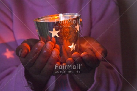 Fair Trade Photo Activity, Candle, Care, Carrying, Christmas, Closeup, Colour image, Evening, Giving, Hand, Horizontal, Indoor, Light, One girl, People, Peru, Pink, Seasons, South America, Star, Warmth, Winter