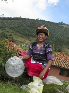 Fair Trade Photo 30-35 years, Activity, Agriculture, Clothing, Colour image, Day, Ethnic-folklore, Farmer, House, Latin, One woman, Outdoor, People, Peru, Rural, Scenic, Smiling, South America, Traditional clothing, Travel, Vertical, Working