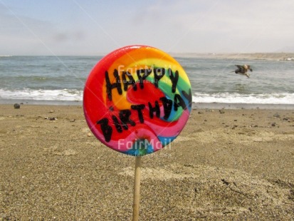 Fair Trade Photo Beach, Birthday, Closeup, Colour image, Day, Horizontal, Letter, Lollypop, Multi-coloured, Outdoor, Peru, Sand, Sea, South America