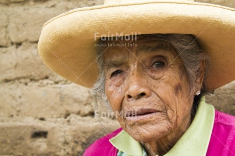 Fair Trade Photo Activity, Casual clothing, Clothing, Colour image, Day, Hat, Horizontal, Latin, Looking at camera, Old age, One woman, Outdoor, People, Peru, Pink, Portrait headshot, Rural, South America, Street, Streetlife