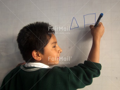 Fair Trade Photo 5 -10 years, Activity, Clothing, Day, Education, Horizontal, Indoor, Latin, One boy, People, Peru, Portrait halfbody, School, South America, Uniform, Writing