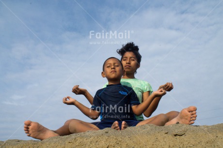 Fair Trade Photo Activity, Beach, Colour image, Day, Horizontal, Meditating, Outdoor, People, Peru, Relaxing, South America, Spirituality, Two children, Yoga