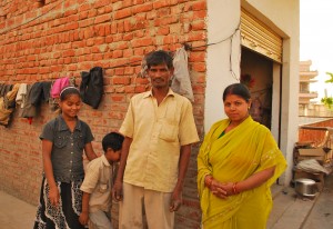 Aradhana's family in front of her house