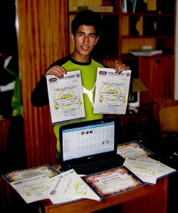 Elmer with his certificates and laptop