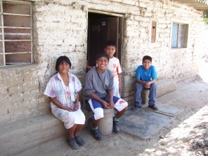 Juan Carlos with his family in front of his parents house Juan Carlos with his family in front of his parents house