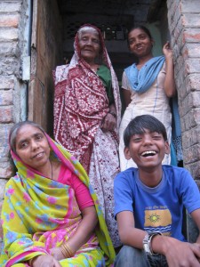 Kaushal with his family in front of his house
