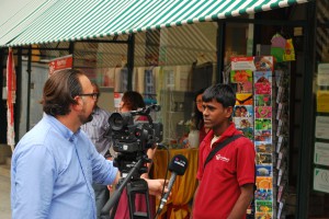 Dhiraj explaining German television the unique story behind his cards