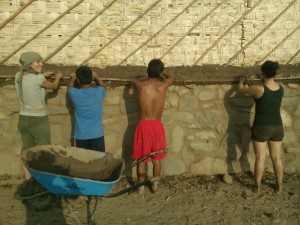 FairMail Peru teenagers and volunteers working on the outer wall