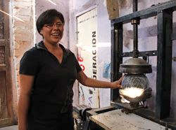Mariluz operating one of the soccer ball machines
